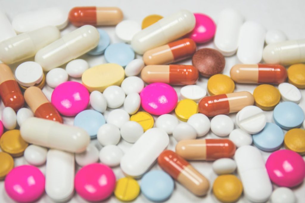 Assorted medication tablets and capsules