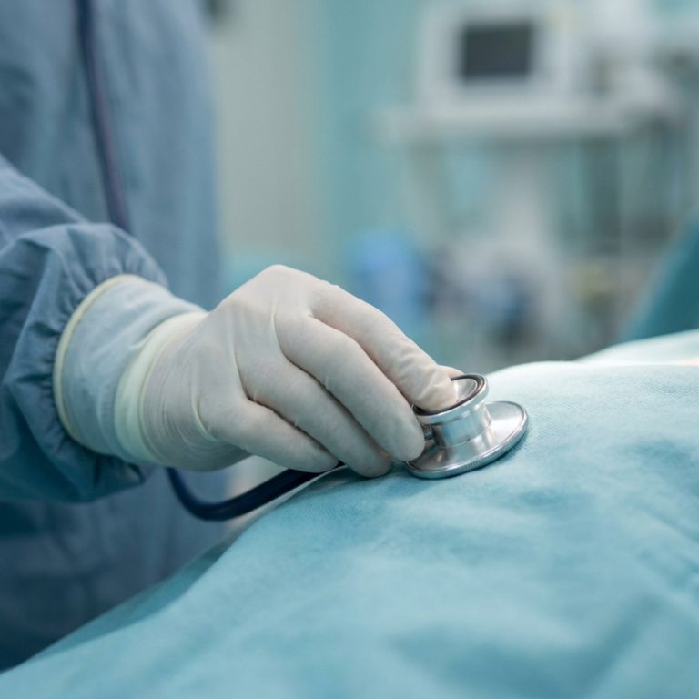 Clinician listening with a stethoscope
